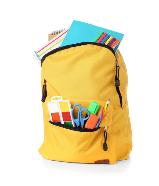 School backpack with stationery on white background — Stock Photo, Image