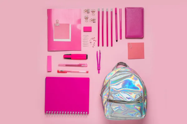 School backpack and stationery on color background — Stock Photo, Image
