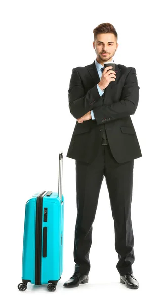 Handsome young businessman with luggage on white background — Stock Photo, Image