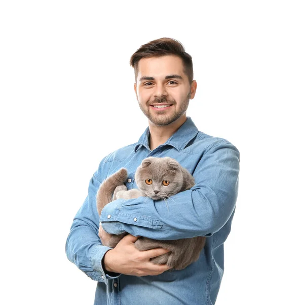 Young man with cute funny cat on white background — Stock Photo, Image