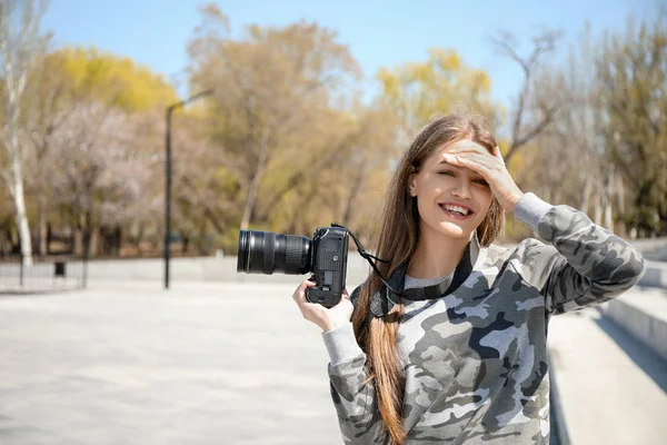 Beautiful female photographer outdoors — Stock Photo, Image