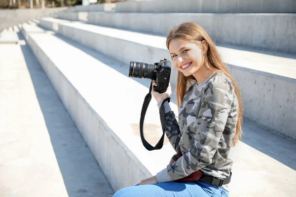 Beautiful female photographer outdoors — Stock Photo, Image