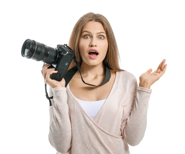 Shocked female photographer on white background — Stock Photo, Image