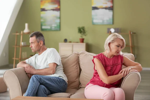 Sad middle-aged couple after quarrel at home — Stock Photo, Image