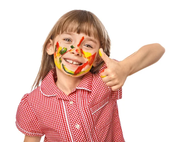Funny little girl with face in paint showing thumb-up on white background — Stock Photo, Image