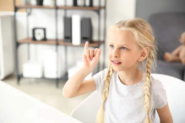 Little deaf mute girl using sign language at home — Stock Photo, Image