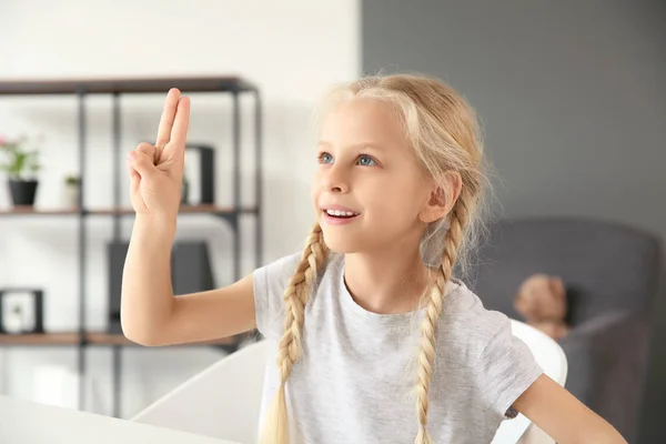Little deaf mute girl using sign language at home — Stock Photo, Image