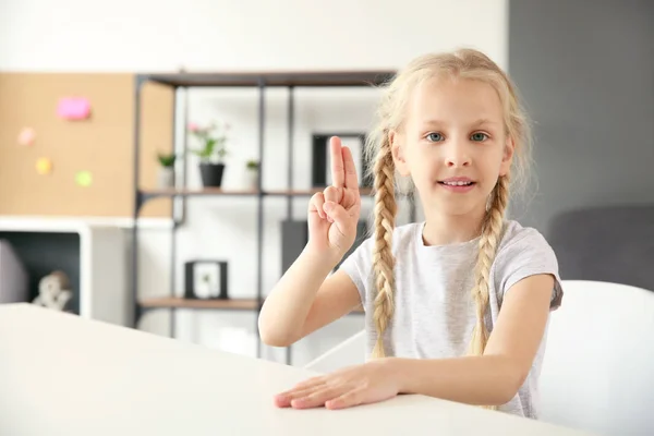 Little deaf mute girl using sign language at home — Stock Photo, Image