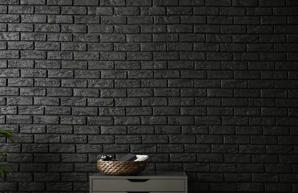 Chest of drawers near brick wall — Stock Photo, Image