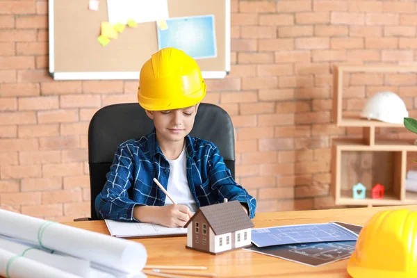 Cute little architect working in office — Stock Photo, Image