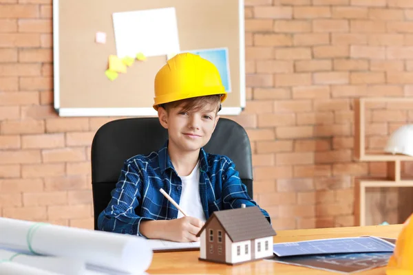 Cute little architect working in office — Stock Photo, Image