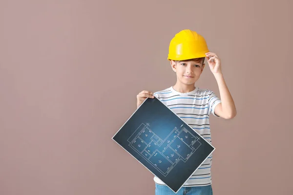 Cute little architect on color background