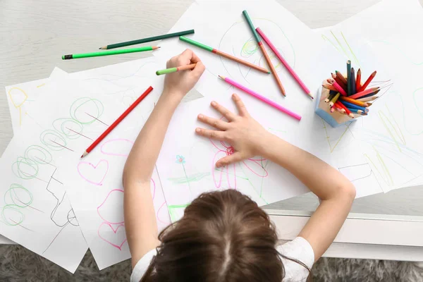 Cute little girl drawing at home, top view — Stock Photo, Image