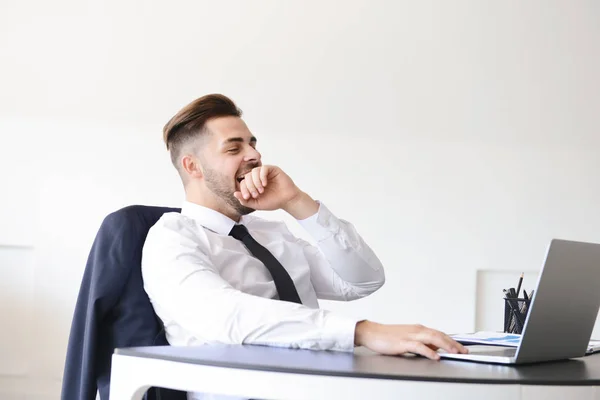 Tired businessman working in office — Stock Photo, Image