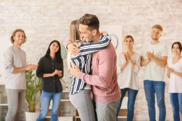 People hugging at group therapy session — Stock Photo, Image