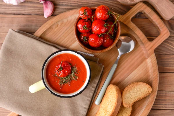 Cup of tasty tomato cream soup on table — Stock Photo, Image