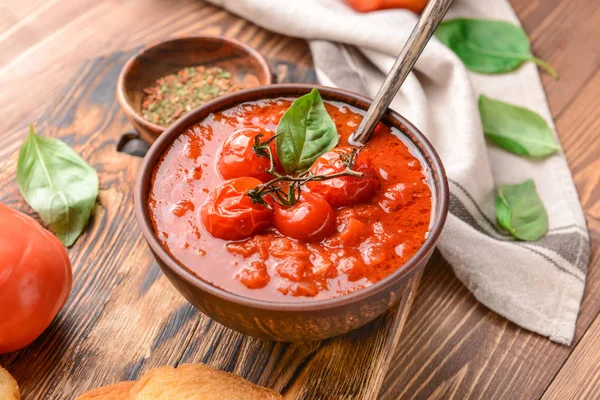 Bowl of tasty tomato cream soup on wooden table — Stock Photo, Image