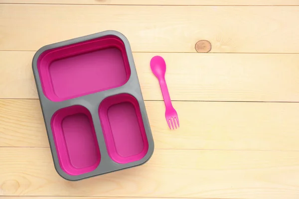 Plastic lunch box on wooden background — Stock Photo, Image