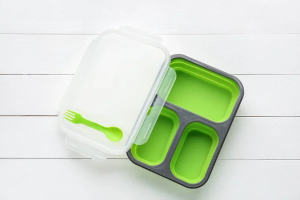 Plastic lunch box on white wooden background — Stock Photo, Image