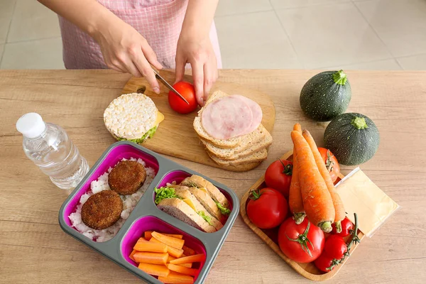 Woman preparing tasty lunch in kitchen — Stock Photo, Image