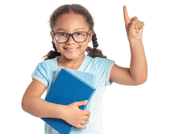 Adorable little African-American schoolgirl with raised index finger on white background — Stock Photo, Image