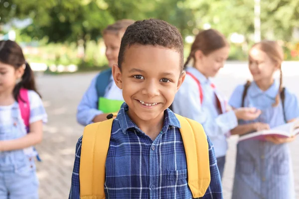 Cute little African-American schoolboy outdoors — Stock Photo, Image