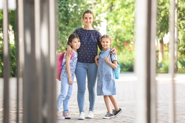 Cute little children going to school with their mother — Stock Photo, Image