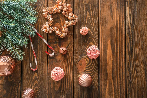 Christmas tree branch and decor on wooden background — Stock Photo, Image