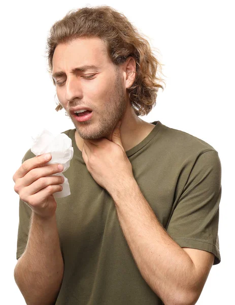 Больной молодой человек с дворником для носа на белом фоне — стоковое фото