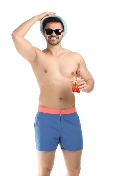 Happy young man with cocktail on white background — Stock Photo, Image