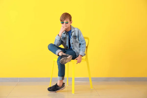 Stylish boy in jeans clothes near color wall — Stock Photo, Image