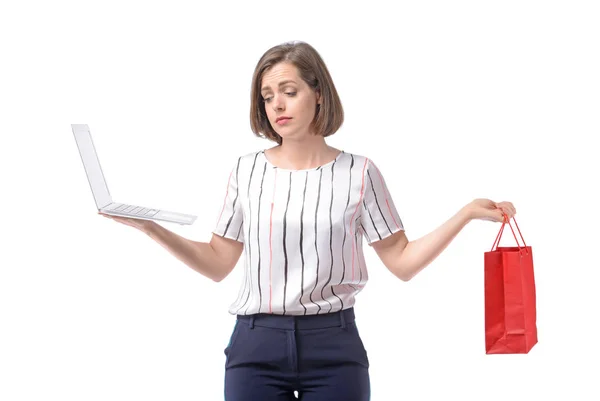 Sad businesswoman with laptop and shopping bag on white background. Concept of balance between work and leisure — Stock Photo, Image