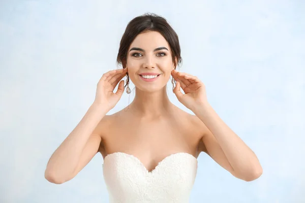 Beautiful young bride on light background — Stock Photo, Image