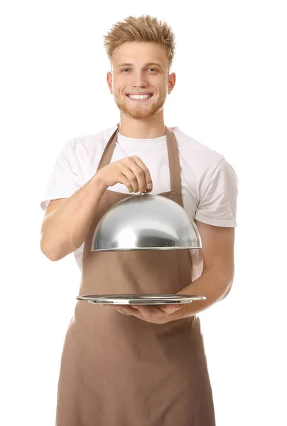 Handsome male chef with tray and cloche on white background Stock Image