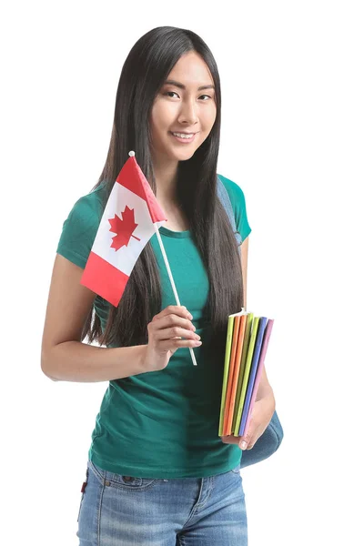 Ázsiai diák a kanadai zászló fehér háttér — Stock Fotó