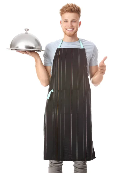 Bonito chef masculino com bandeja e cloche no fundo branco — Fotografia de Stock