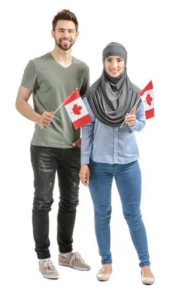 Young people with Canadian flags on white background — Stock Photo, Image