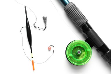 Fishing tackle and tools on white background clipart