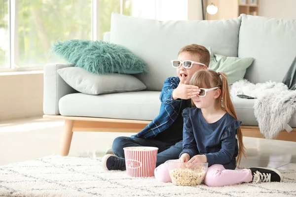 Little children watching scary movie at home