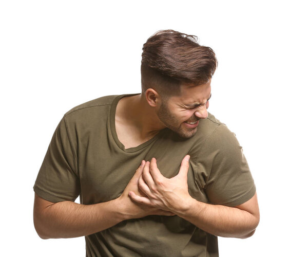 Young man suffering from heart attack on white background