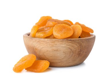 Bowl with dried apricots on white background clipart