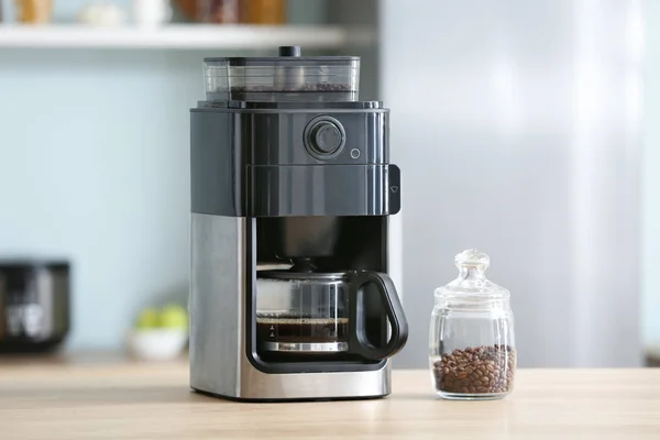 Modern coffee machine on table in kitchen — Stock Photo, Image