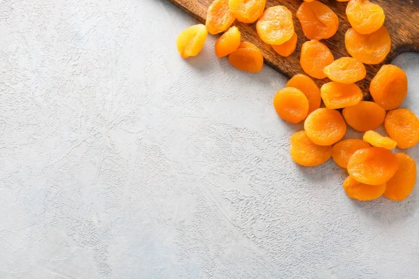 Tasty dried apricots on light background — Stock Photo, Image