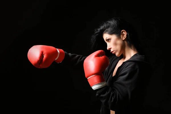 Sporty female boxer on dark background — Stock Photo, Image