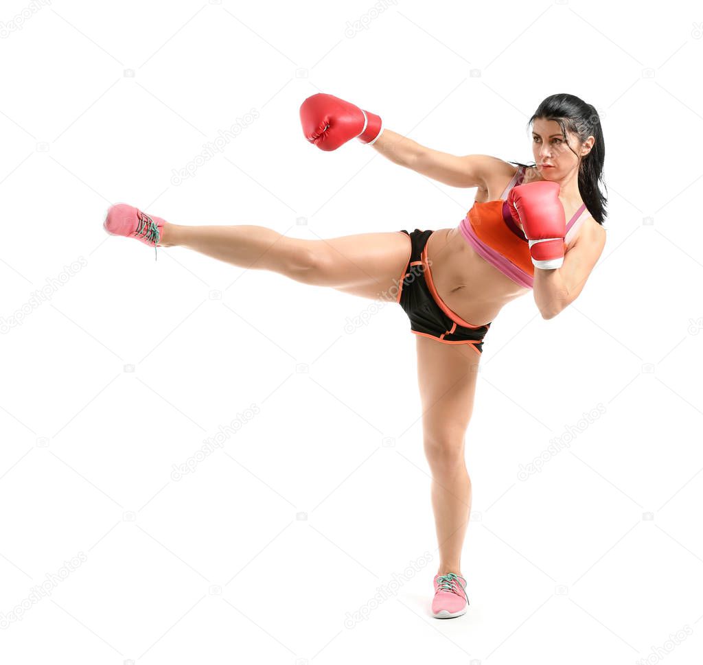 Female kickboxer on white background