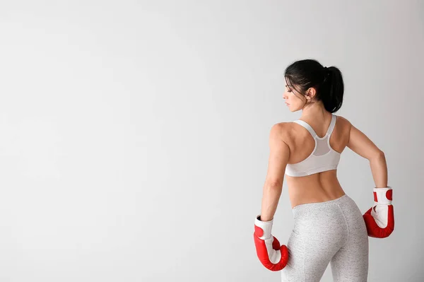Sporty female boxer on white background — Stock Photo, Image