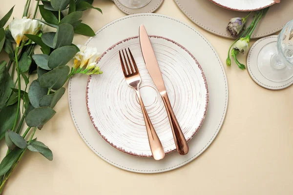 Beautiful table setting with floral decor on light background — Stock Photo, Image