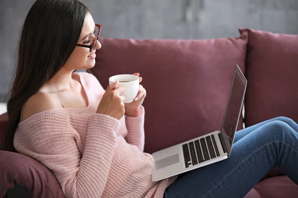 Young female blogger with laptop at home — Stock Photo, Image