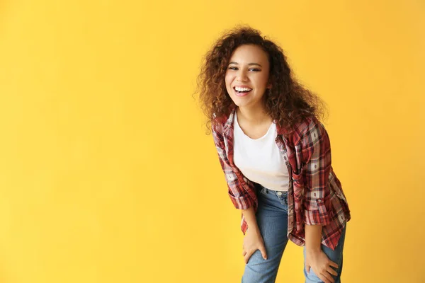 Happy African-American woman on color background — Stock Photo, Image