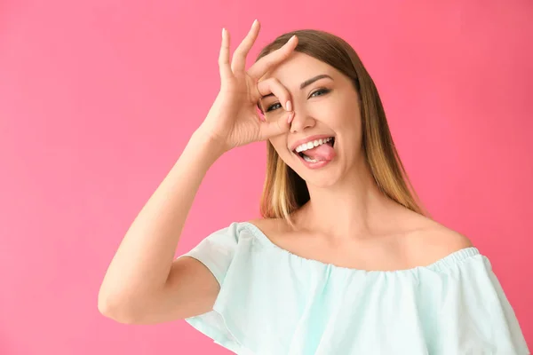 Funny young woman on color background — Stock Photo, Image